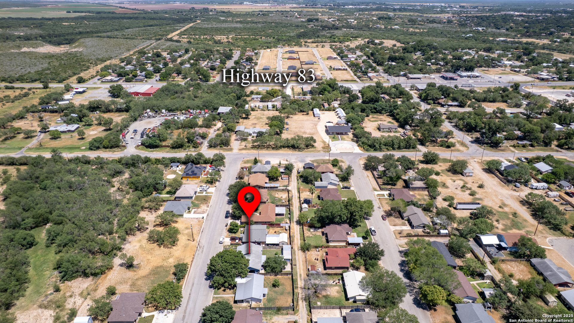 121 Rio Grande Street Uvalde, TX 78801 - Photo 24 of 29 an aerial view of residential houses with outdoor space