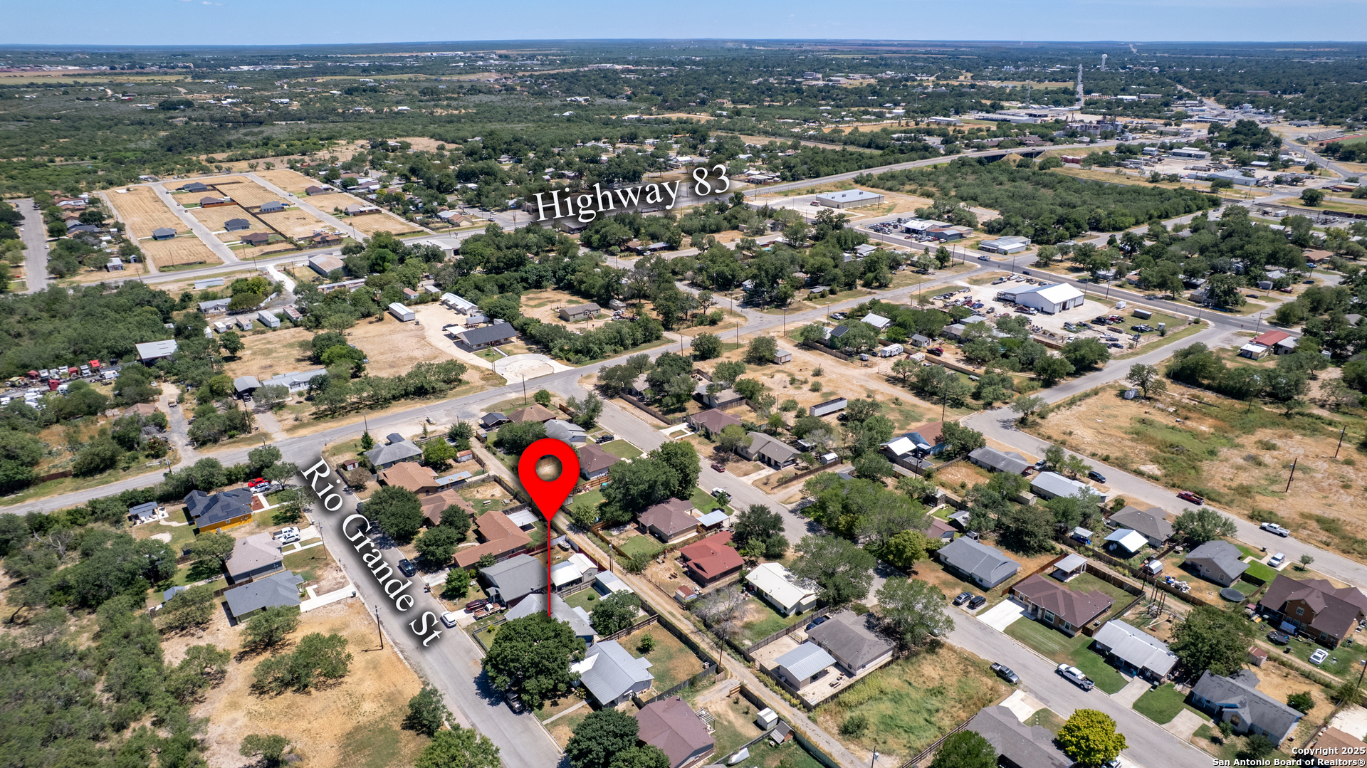 121 Rio Grande Street Uvalde, TX 78801 - Photo 25 of 29 an aerial view of residential houses with city view