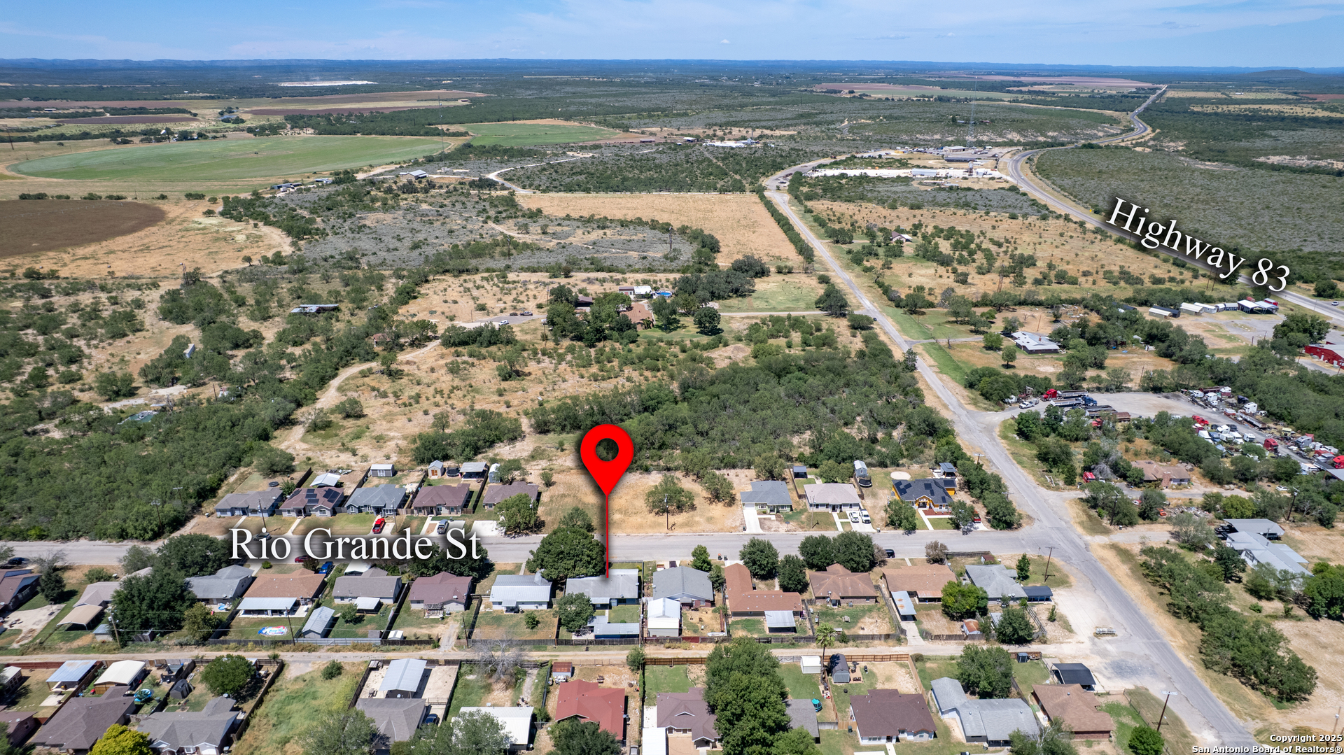 121 Rio Grande Street Uvalde, TX 78801 - Photo 27 of 29 an aerial view of residential houses with outdoor space