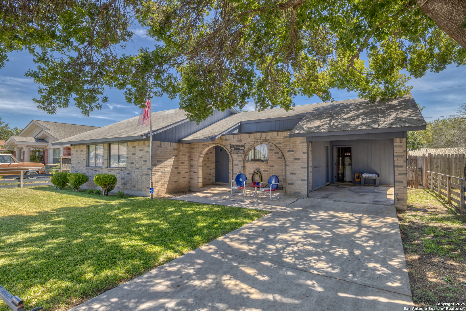 121 Rio Grande Street Uvalde, TX 78801 - Photo 3 of 29 a front view of a house with a yard and porch