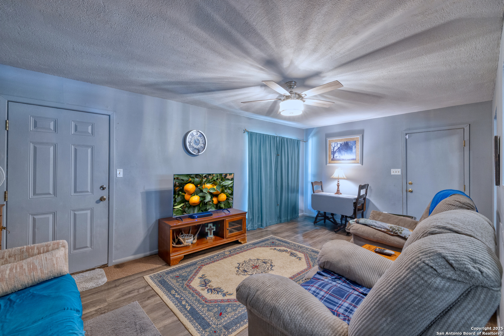 121 Rio Grande Street Uvalde, TX 78801 - Photo 6 of 29 a bedroom with a bed and a flat screen tv