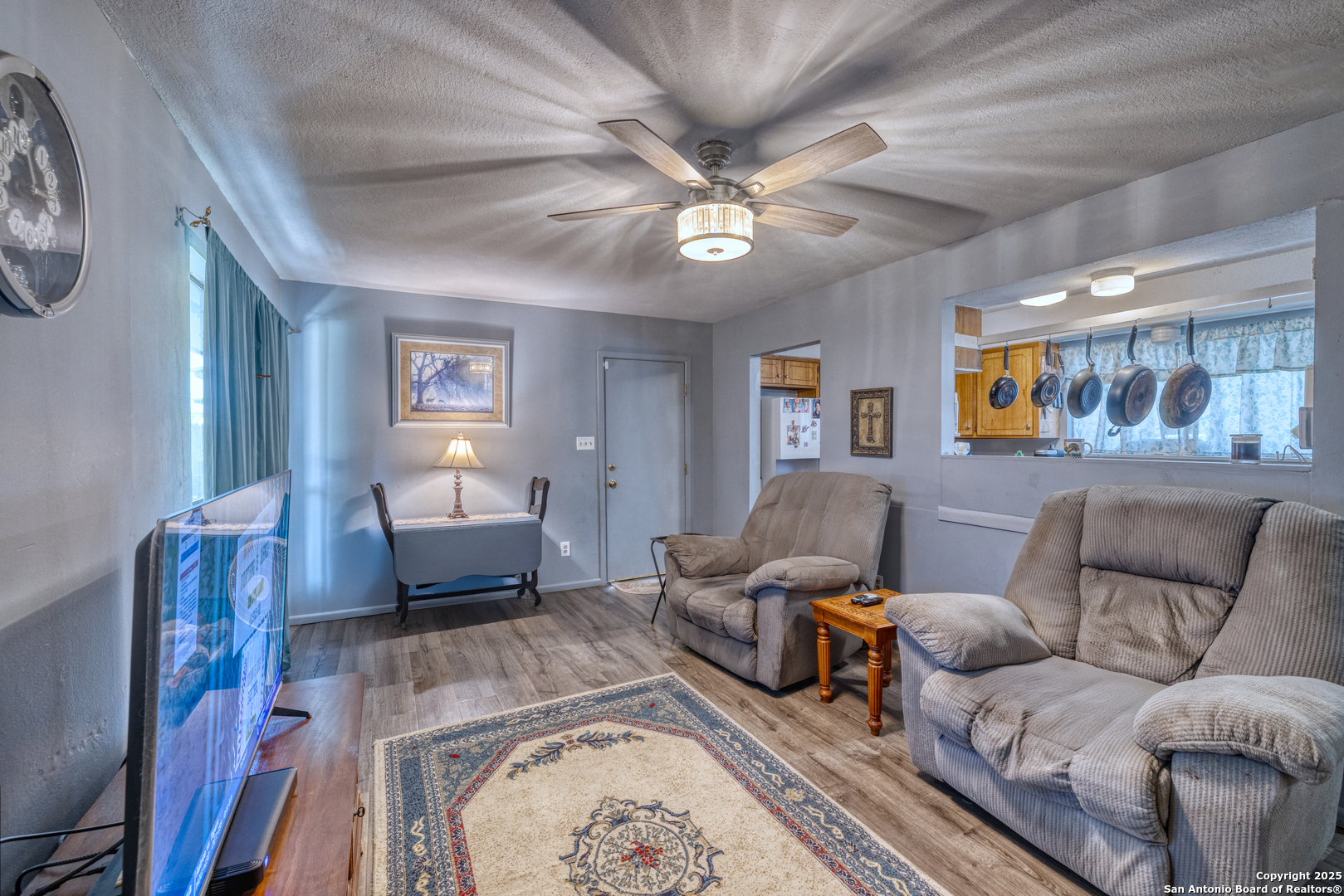 121 Rio Grande Street Uvalde, TX 78801 - Photo 7 of 29 a living room with furniture and a window