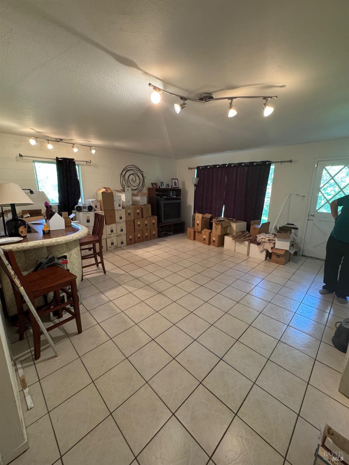 896 Sanitarium Road Deer Park, CA 94574 - Photo 18 of 20 a living room with furniture a table and chairs