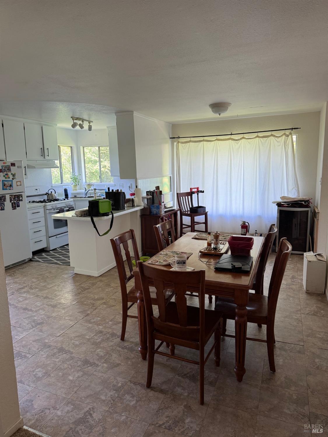 896 Sanitarium Road Deer Park, CA 94574 - Photo 9 of 20 a view of a dining room and livingroom