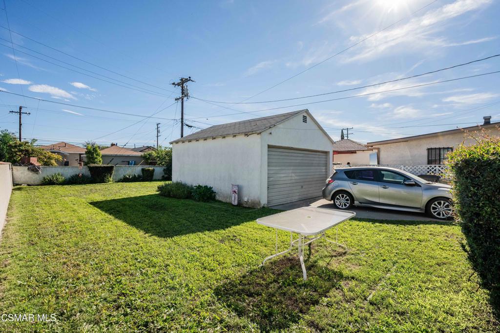 344 North 1st Street Montebello, CA 90640 - Photo 14 of 16 a front view of a house with a yard and garage