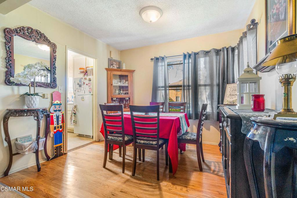 344 North 1st Street Montebello, CA 90640 - Photo 7 of 16 a view of a dining room with furniture and a kitchen