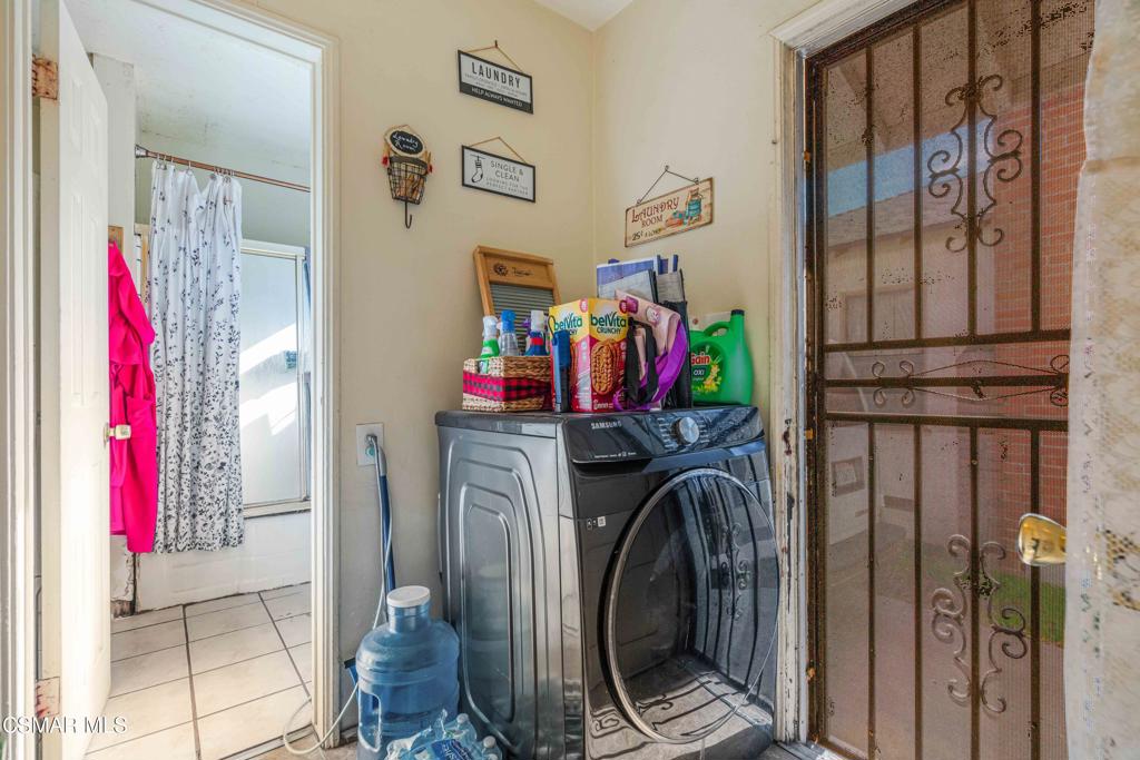 344 North 1st Street Montebello, CA 90640 - Photo 9 of 16 a view of a bedroom with a bed and a window