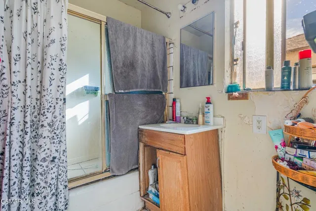a utility room with cabinets washer and dryer