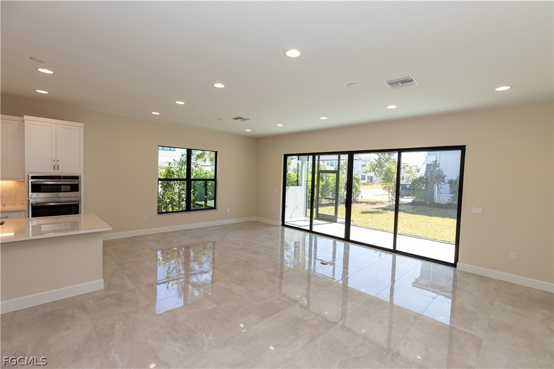 12801 Springbrook Court Estero, FL 33928 - Photo 19 of 49 a view of an empty room with a window