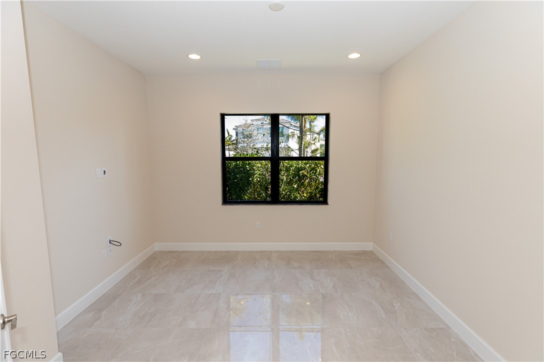 12801 Springbrook Court Estero, FL 33928 - Photo 22 of 49 an empty room with a window