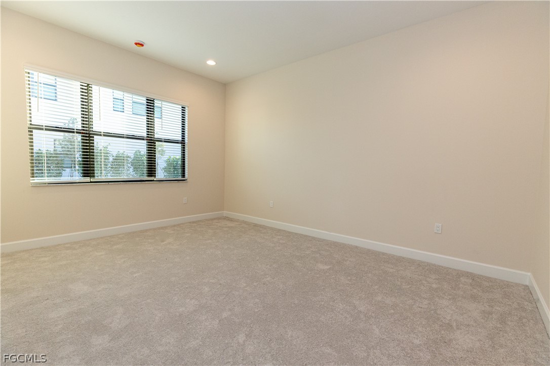12801 Springbrook Court Estero, FL 33928 - Photo 26 of 49 an empty room with a window