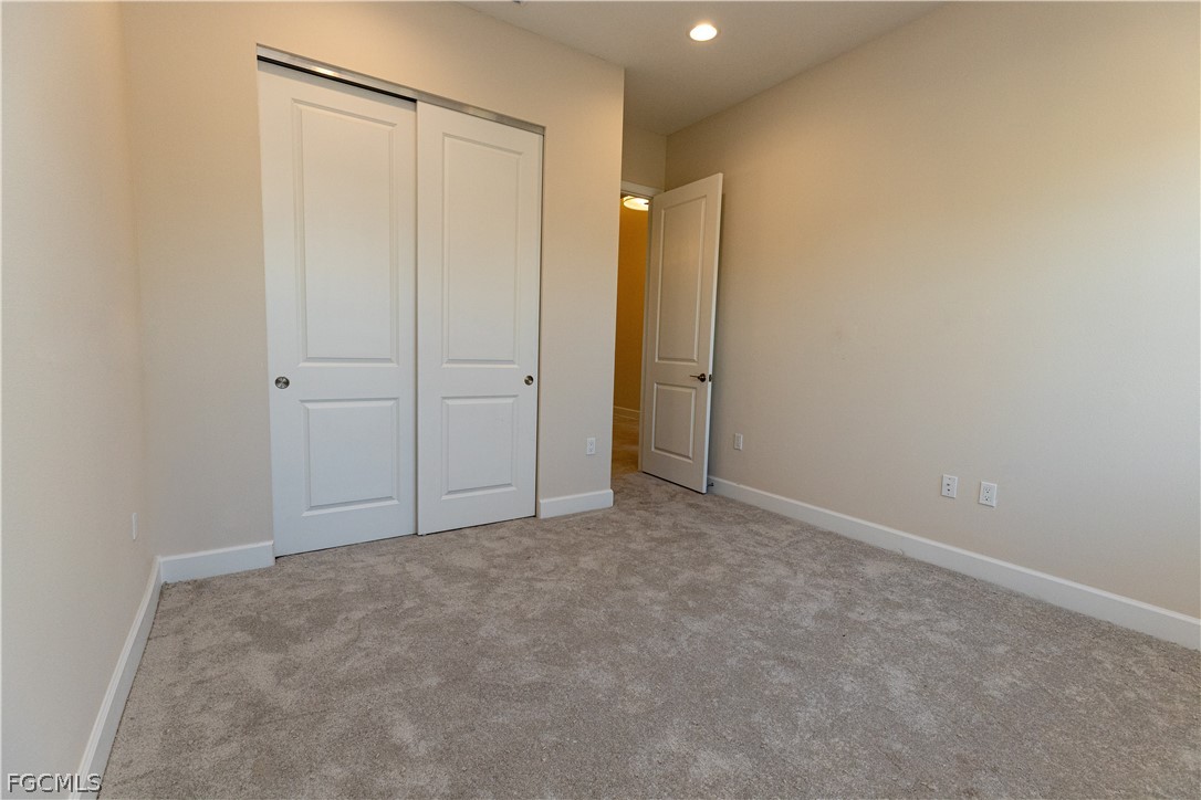 12801 Springbrook Court Estero, FL 33928 - Photo 27 of 49 an empty room with closet area