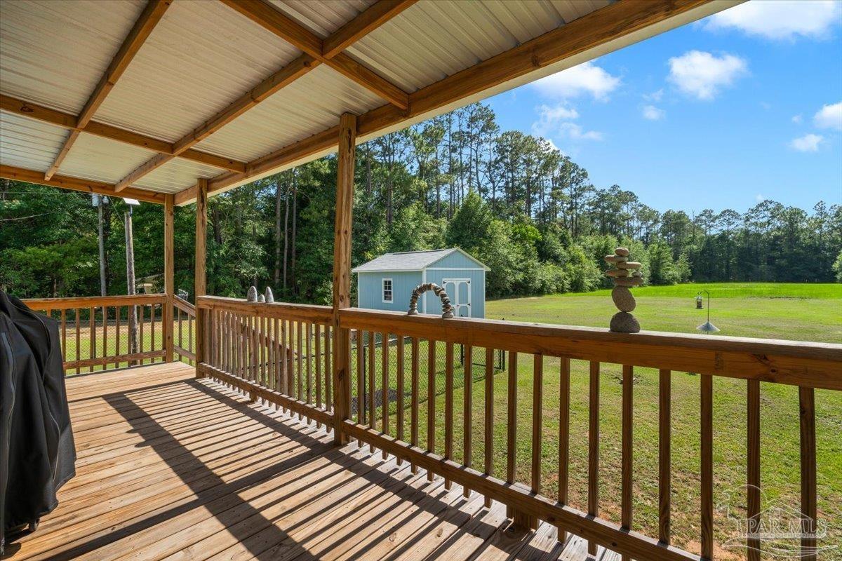 4955 Blue Ribbon Drive Milton, FL 32583 - Photo 24 of 32 a view of a wooden deck