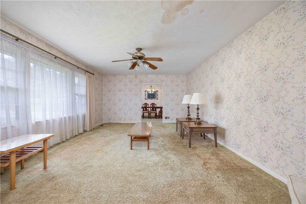 5201 Summerville Road Phenix City, AL 36867 - Photo 18 of 35 Sitting room featuring ceiling fan, carpet floors, and wallpapered walls