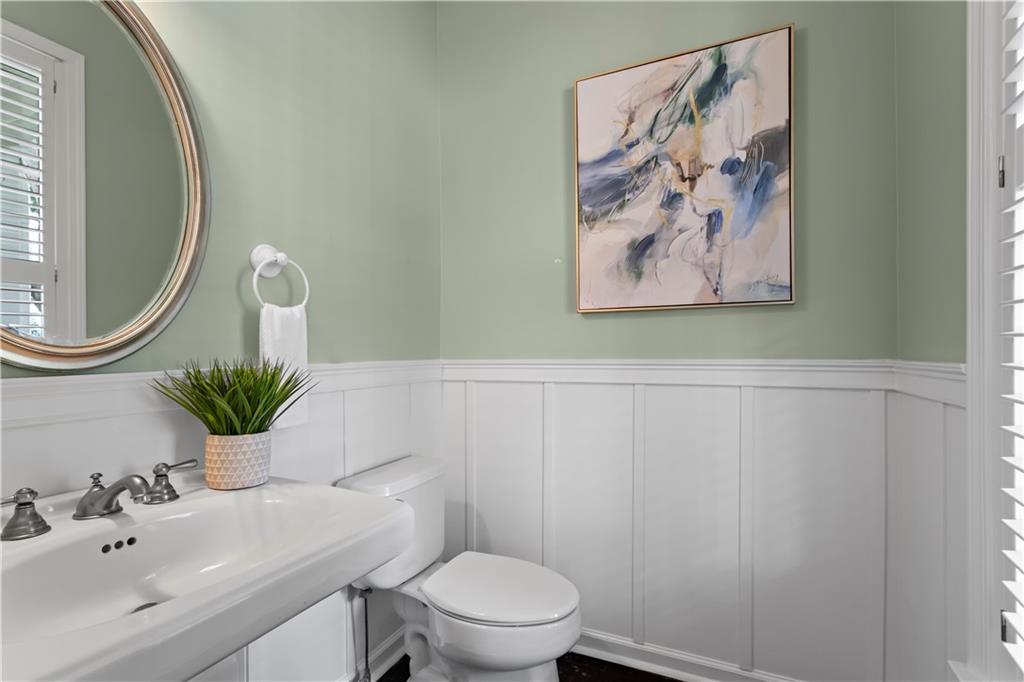 108 Laurel Street Canton, GA 30114 - Photo 13 of 33 a bathroom with a toilet and a sink