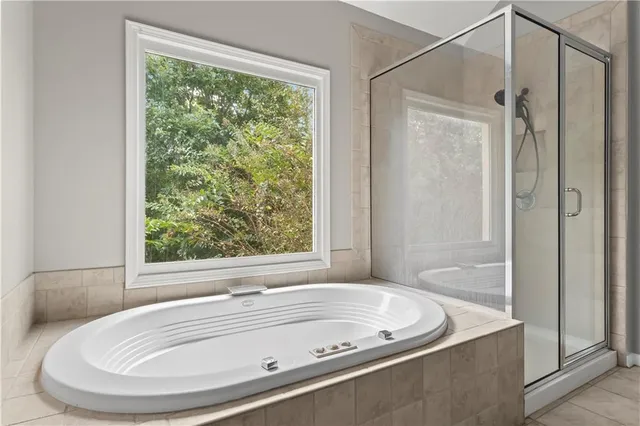 a bath tub sitting next to a window