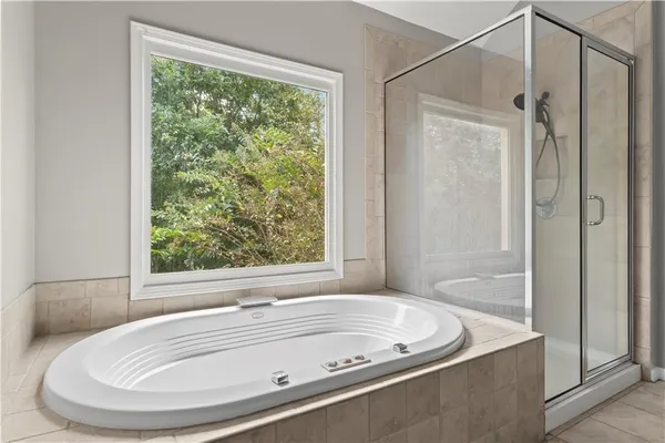 a bath tub sitting next to a window