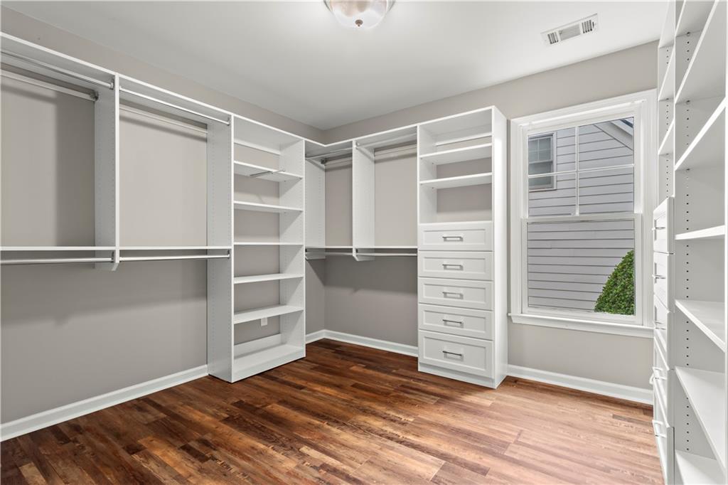 108 Laurel Street Canton, GA 30114 - Photo 20 of 33 a view of an empty room with a window and wooden floor
