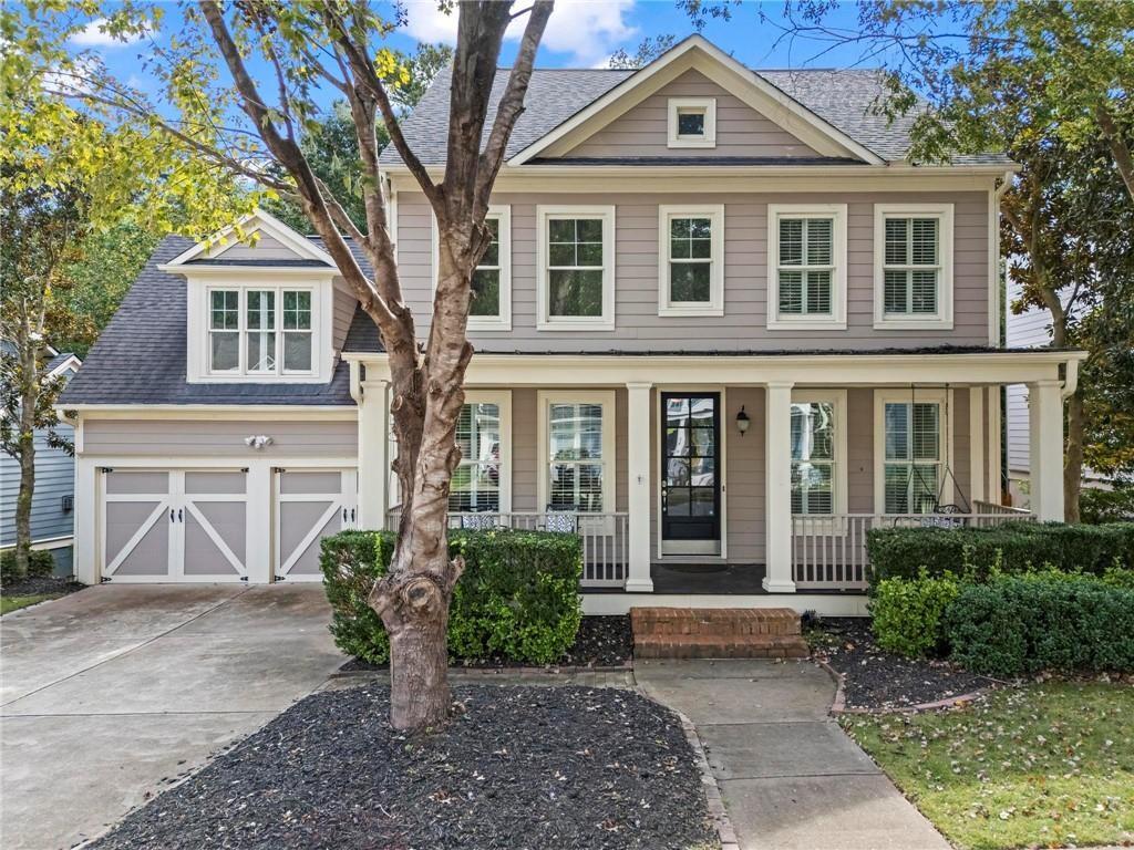 108 Laurel Street Canton, GA 30114 - Photo 2 of 33 a front view of a house with garden