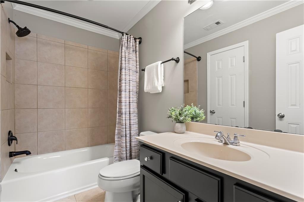 108 Laurel Street Canton, GA 30114 - Photo 22 of 33 a bathroom with a sink and a mirror