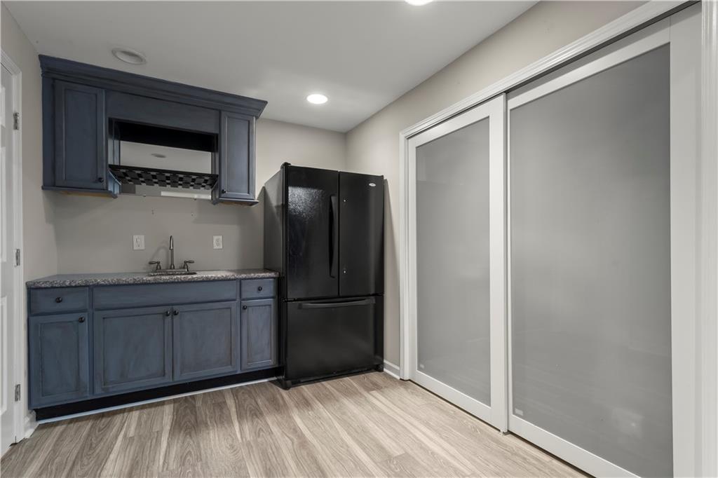 108 Laurel Street Canton, GA 30114 - Photo 27 of 33 a kitchen with a refrigerator and a microwave