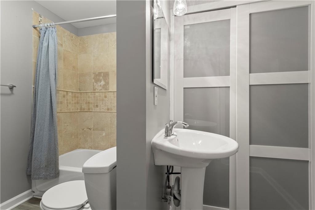 108 Laurel Street Canton, GA 30114 - Photo 28 of 33 a bathroom with a sink toilet and shower