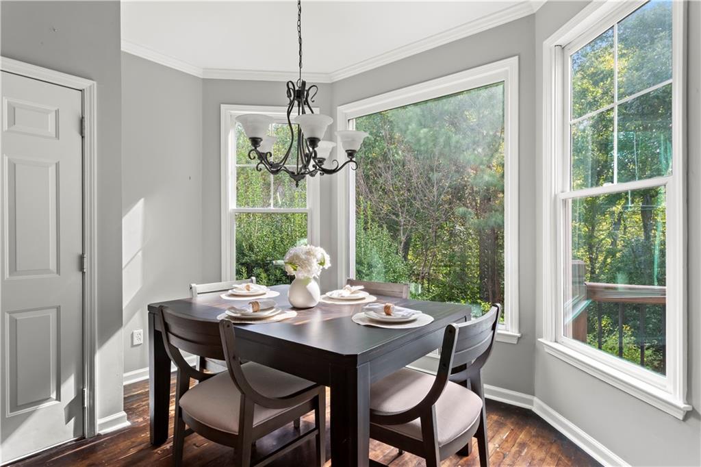 108 Laurel Street Canton, GA 30114 - Photo 7 of 33 a view of a dining room with furniture window and wooden floor