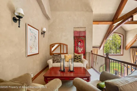 a living room with furniture or couch and a large window