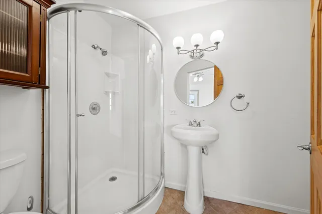 a bathroom with a sink mirror and vanity
