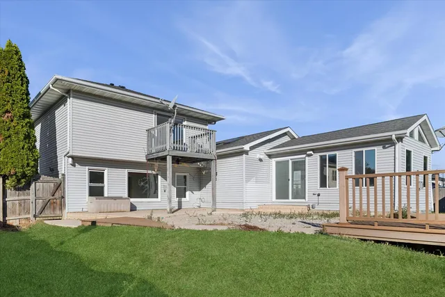 a front view of a house with a garden and yard