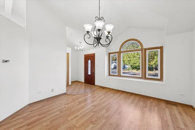 a view of room with window and hardwood floor