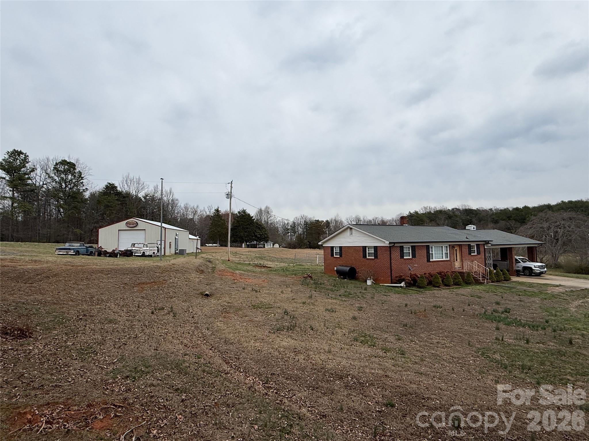 6501 Casar Road Casar, NC 28020 - Photo 27 of 45 a view of large house with a big yard and large trees