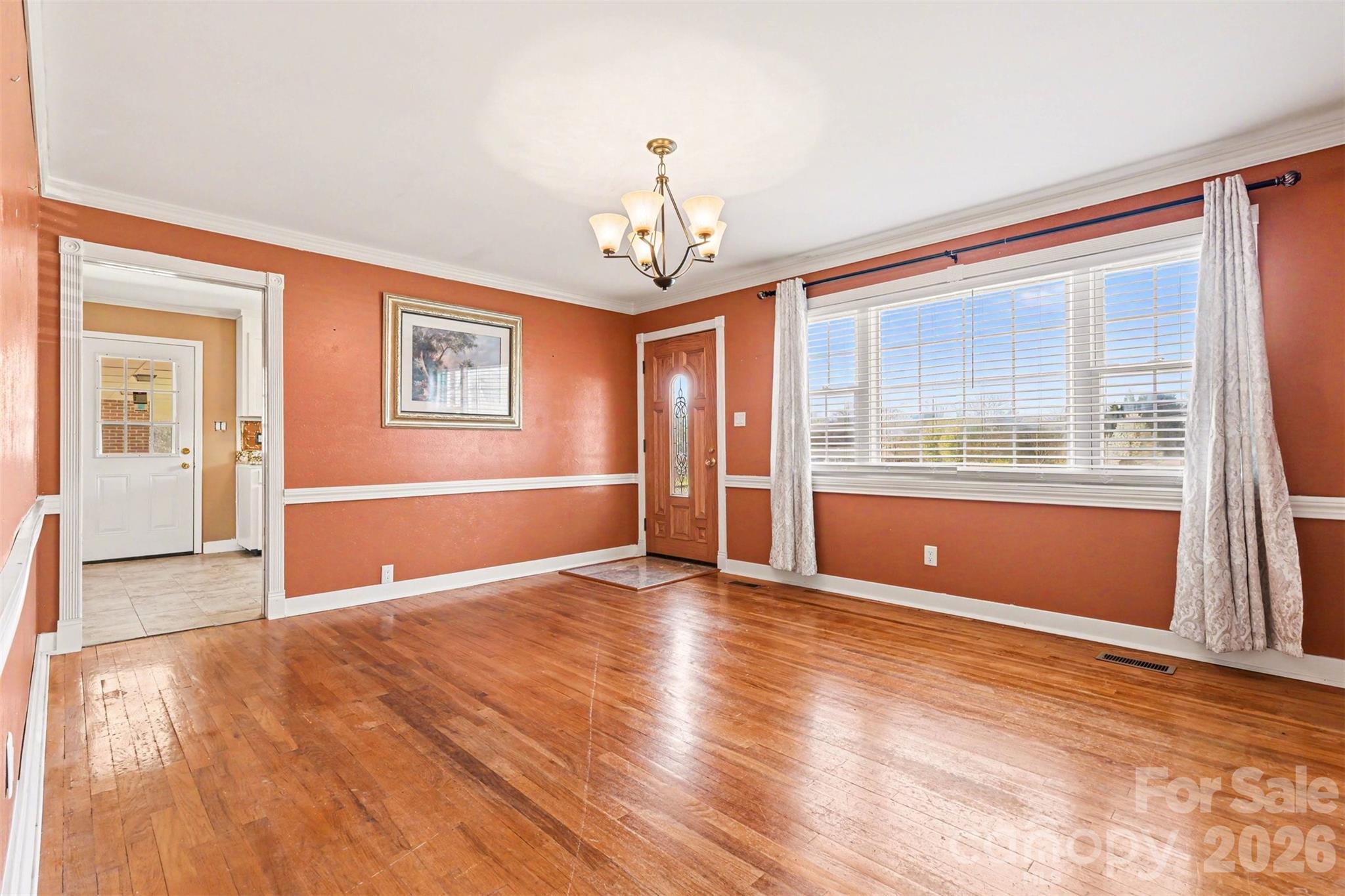 6501 Casar Road Casar, NC 28020 - Photo 3 of 45 a view of an empty room with wooden floor and a window