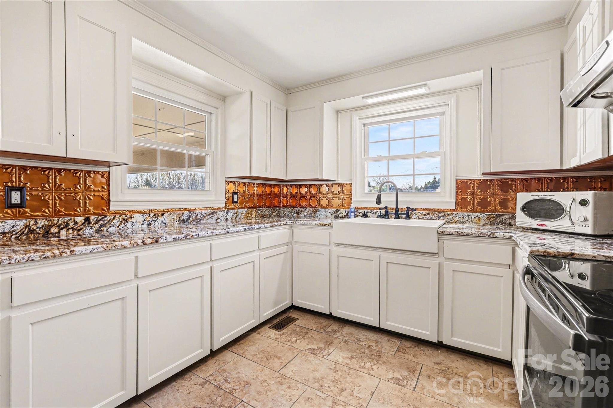 6501 Casar Road Casar, NC 28020 - Photo 5 of 45 a kitchen with stainless steel appliances granite countertop a sink and cabinets with wooden floor