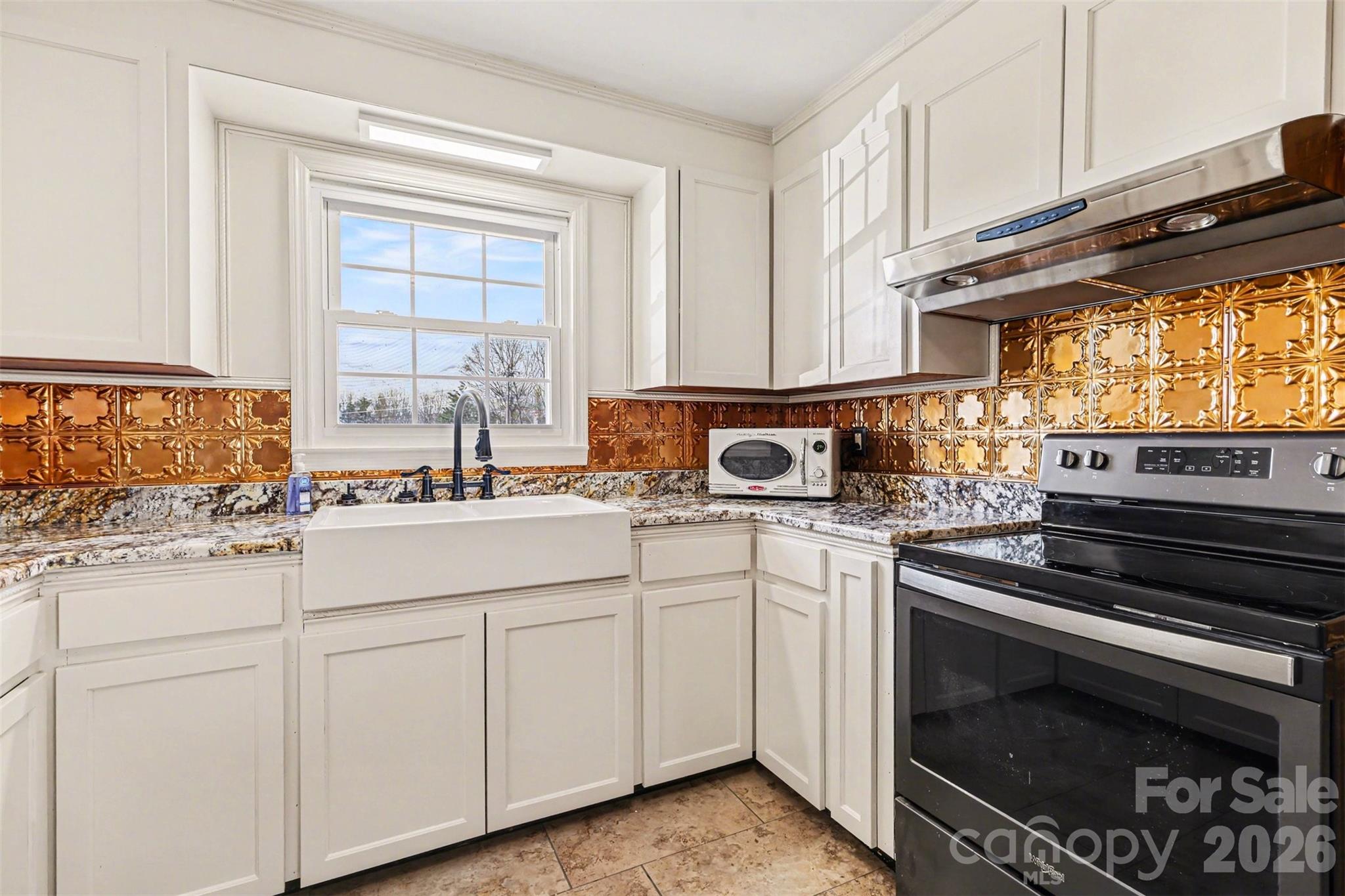 6501 Casar Road Casar, NC 28020 - Photo 6 of 45 a kitchen with granite countertop white cabinets appliances and a window