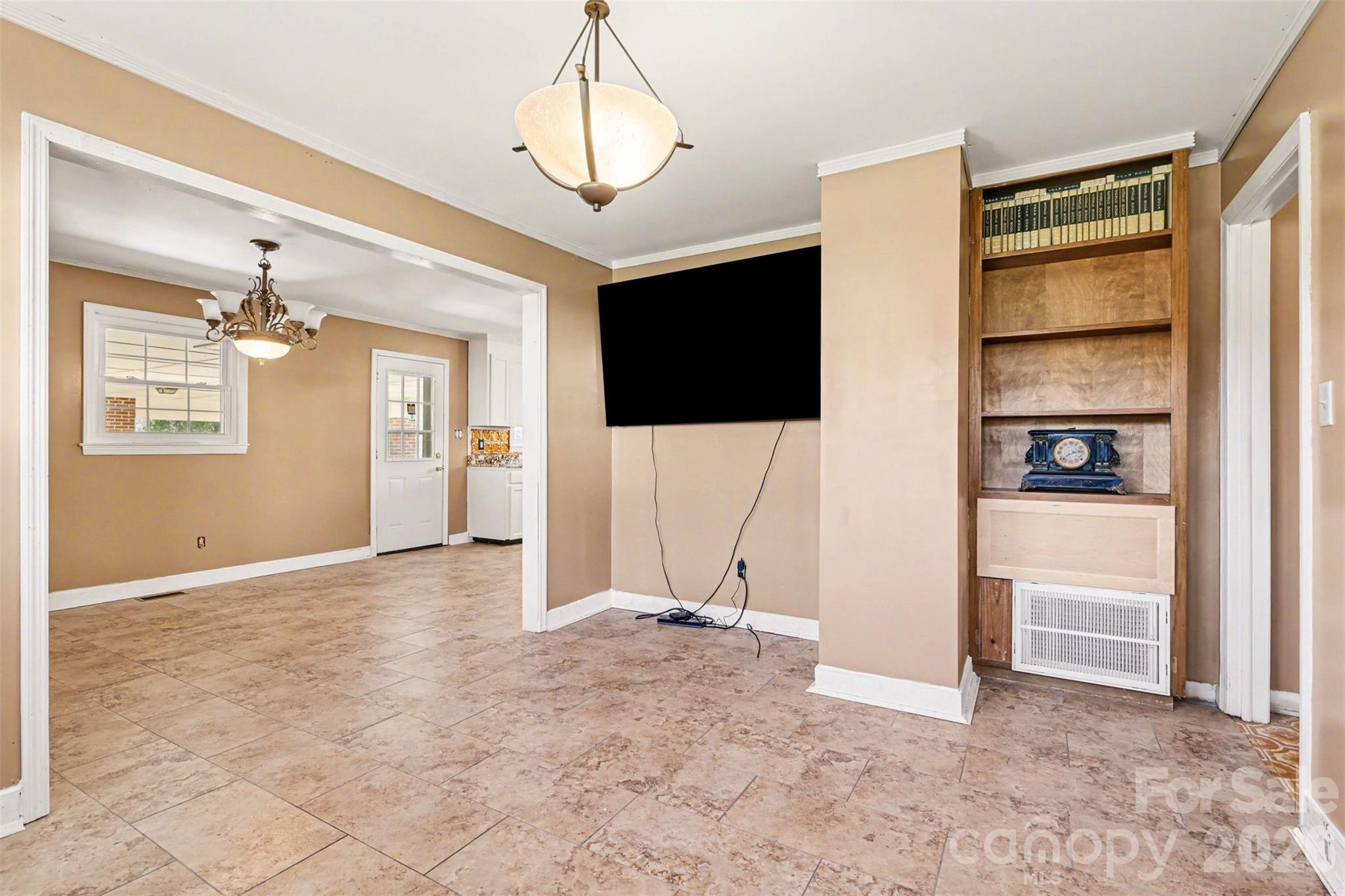 6501 Casar Road Casar, NC 28020 - Photo 10 of 45 a view of an empty room with a cabinet and a flat screen tv