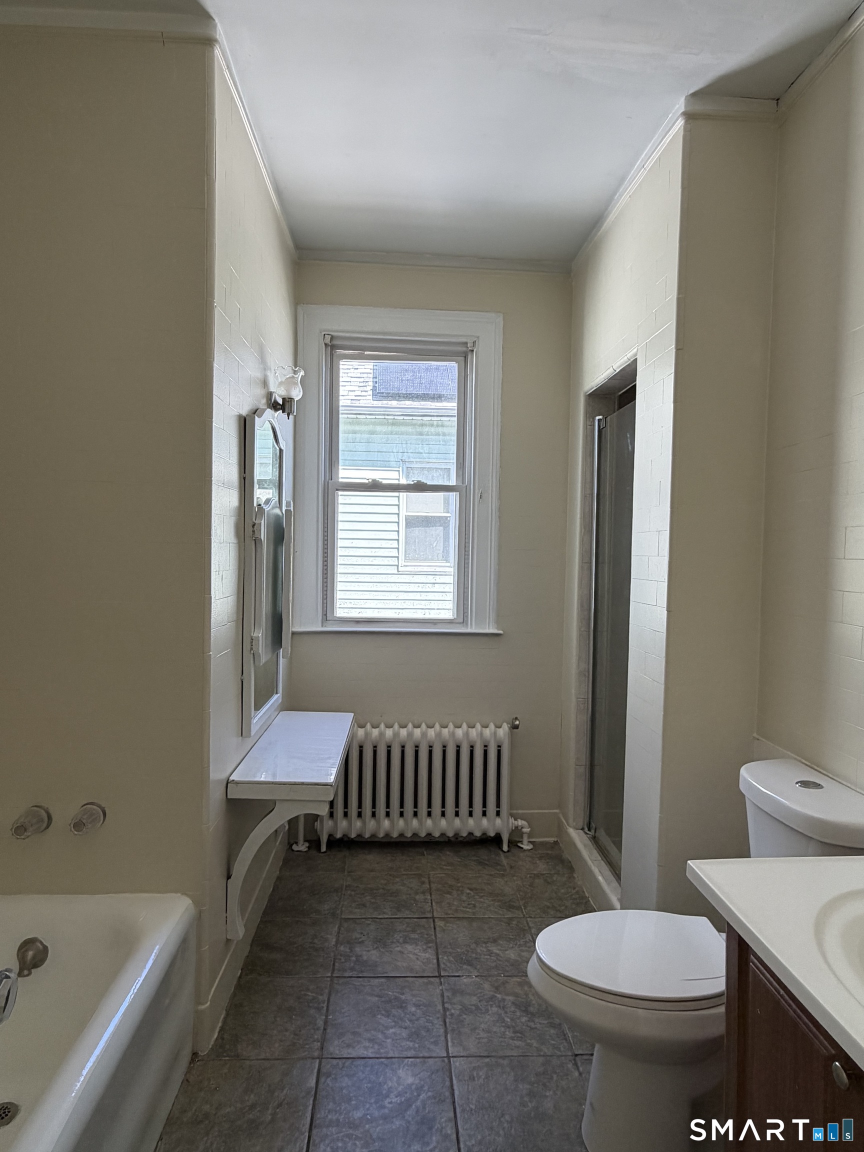 41-43 Hebron Street Hartford, CT 06112 - Photo 13 of 13 a bathroom with a sink toilet and bathtub