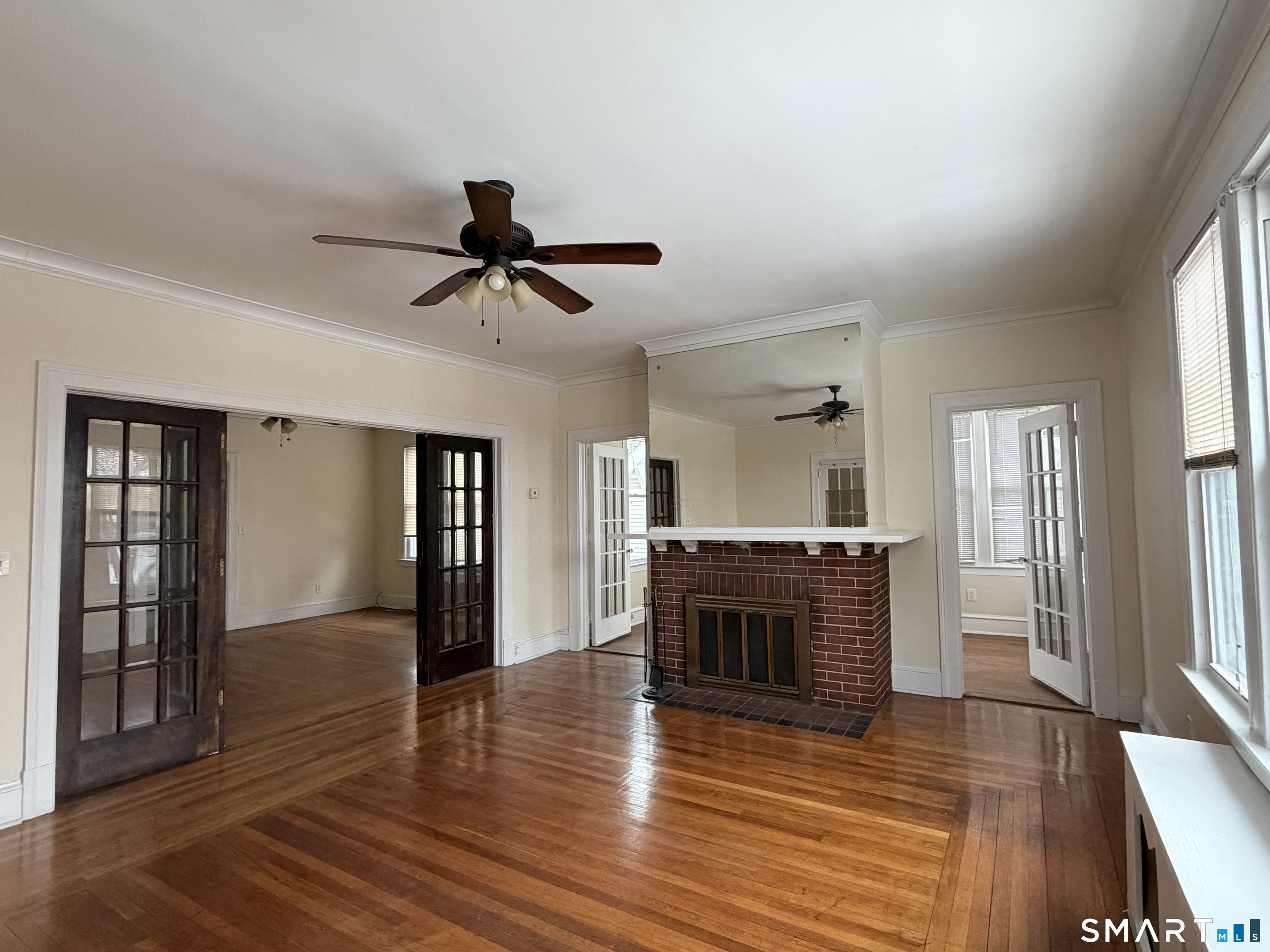 41-43 Hebron Street Hartford, CT 06112 - Photo 3 of 13 a living room with furniture and a fireplace