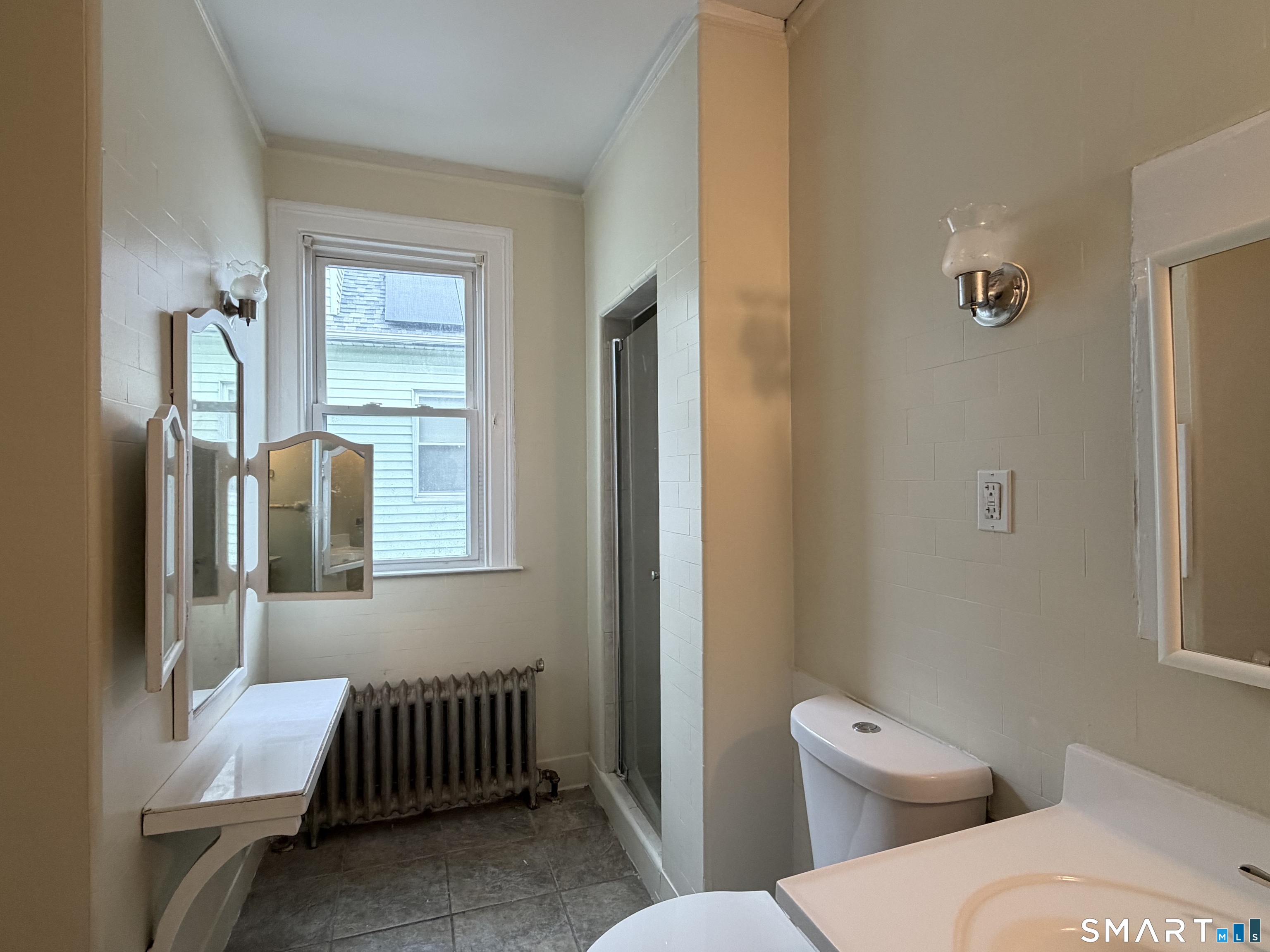 41-43 Hebron Street Hartford, CT 06112 - Photo 7 of 13 a bathroom with a toilet and a sink