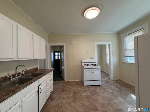 a kitchen that has a sink and a stove