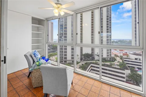 a view of a living room and a balcony