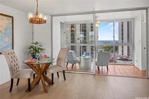 a dining room with furniture and window