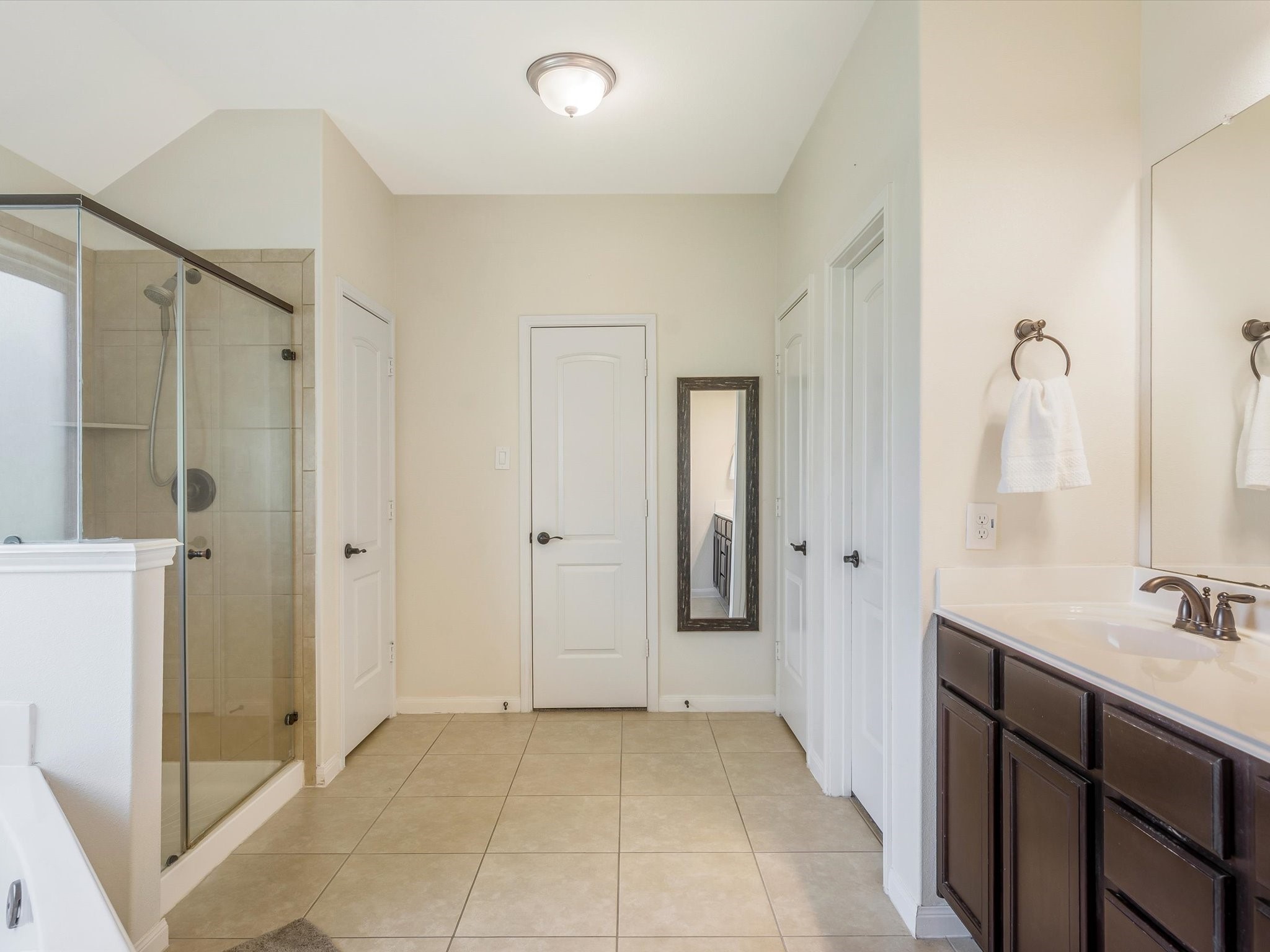 18746 Encinal Trail Magnolia, TX 77355 - Photo 20 of 35 a bathroom with a sink and a mirror