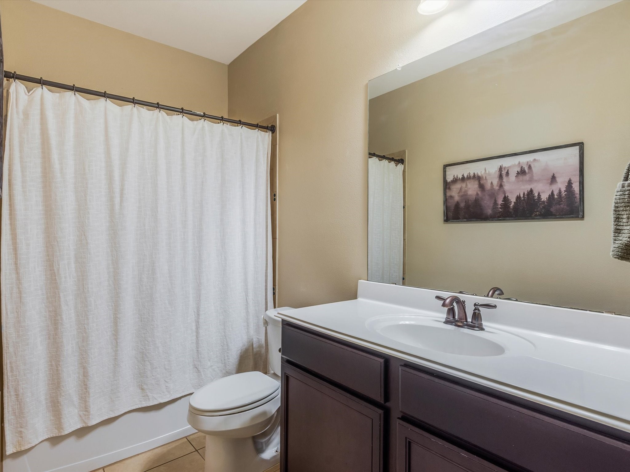 18746 Encinal Trail Magnolia, TX 77355 - Photo 25 of 35 a bathroom with a sink a toilet and a mirror