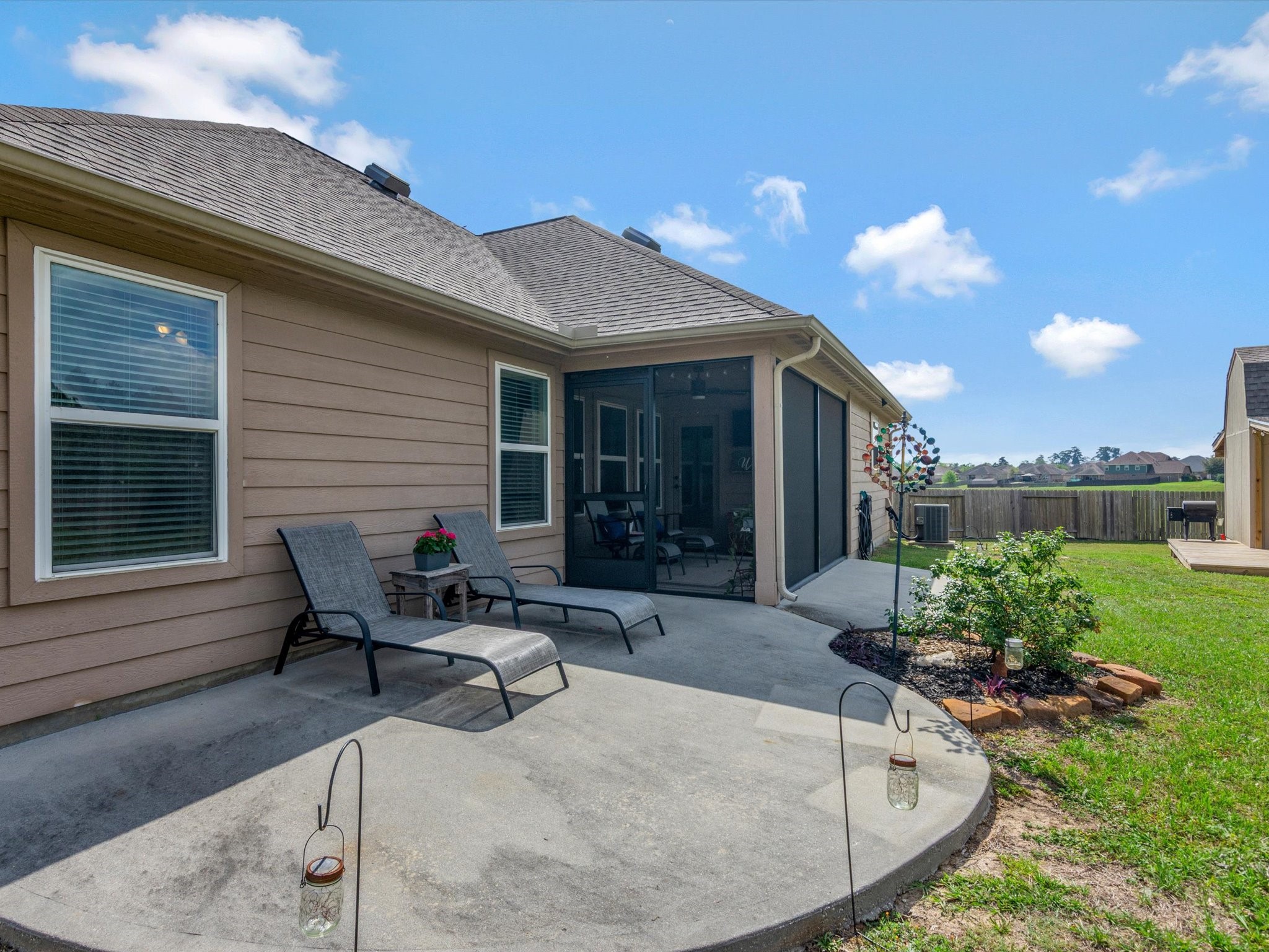18746 Encinal Trail Magnolia, TX 77355 - Photo 28 of 35 a view of a house with backyard and sitting area