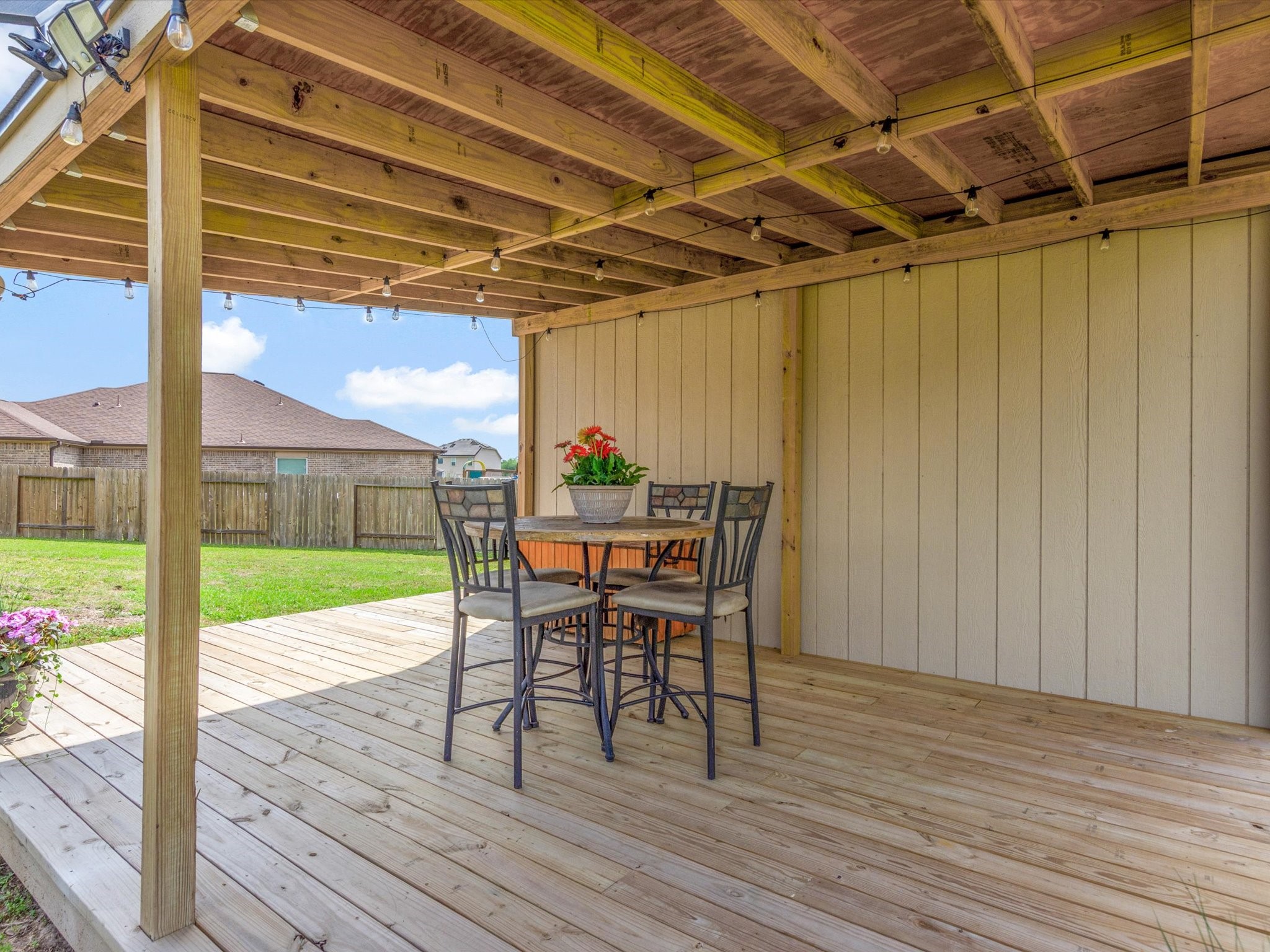 18746 Encinal Trail Magnolia, TX 77355 - Photo 30 of 35 a view of a patio with a table and chairs