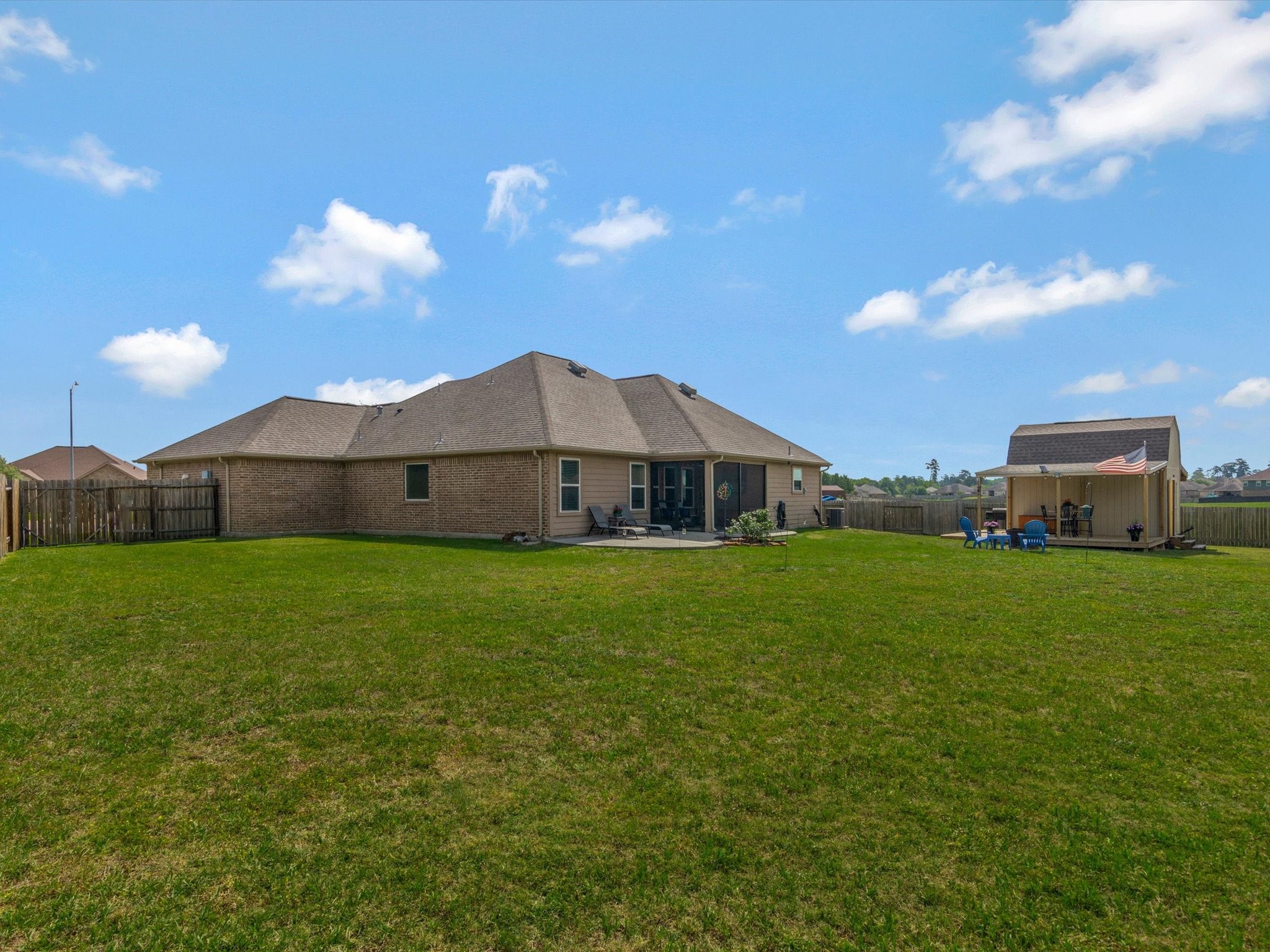 18746 Encinal Trail Magnolia, TX 77355 - Photo 32 of 35 a aerial view of a house next to a yard