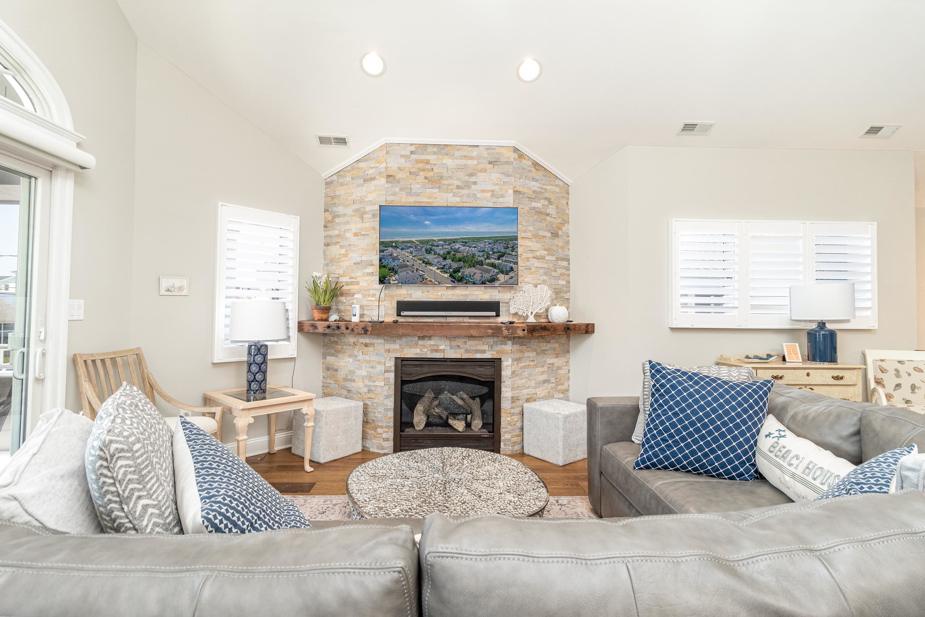 178 37th Street Avalon, NJ 08202 - Photo 13 of 26 a living room with furniture and a fireplace