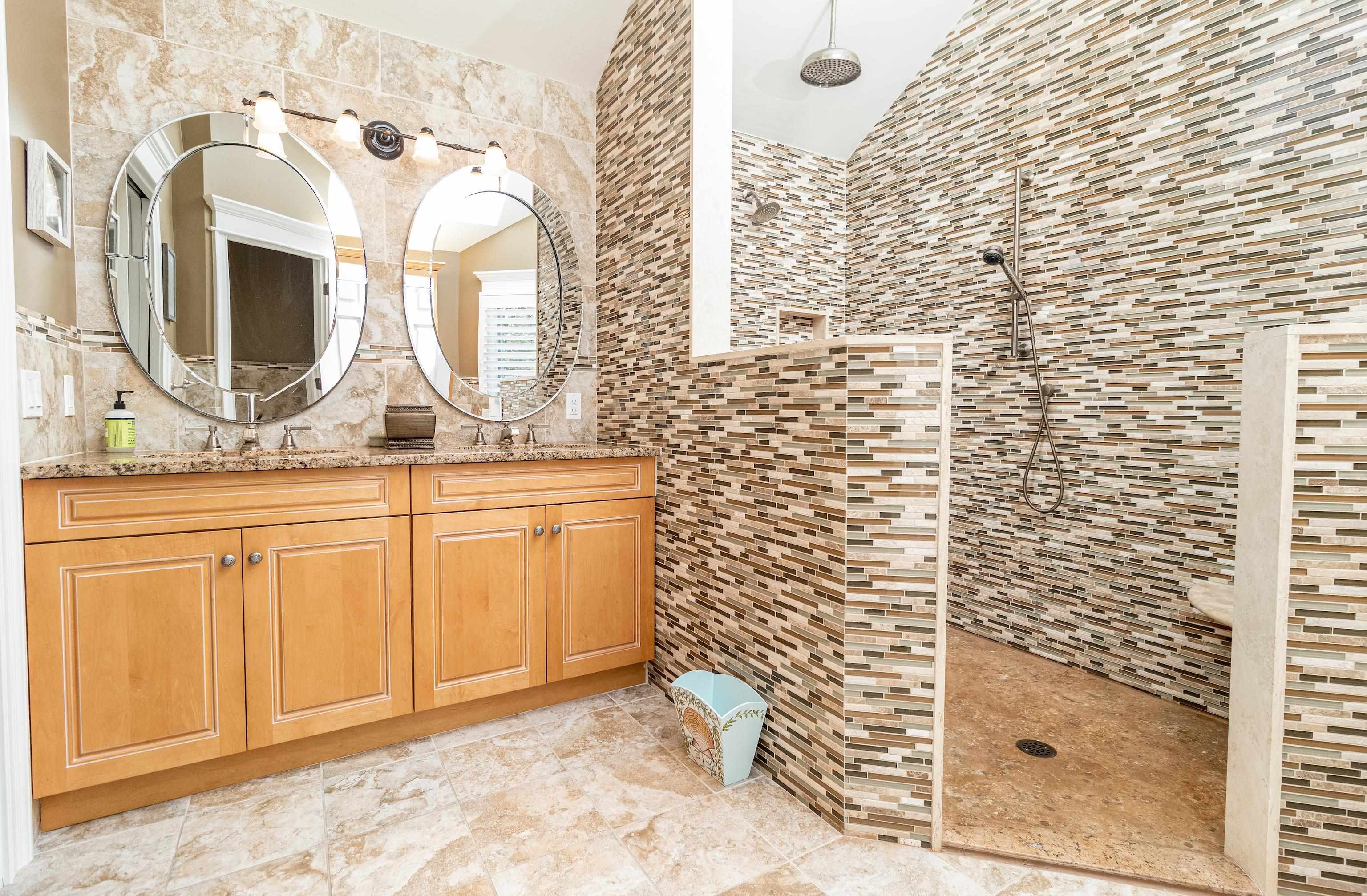 178 37th Street Avalon, NJ 08202 - Photo 23 of 26 a bathroom with a granite countertop sink a mirror and shower