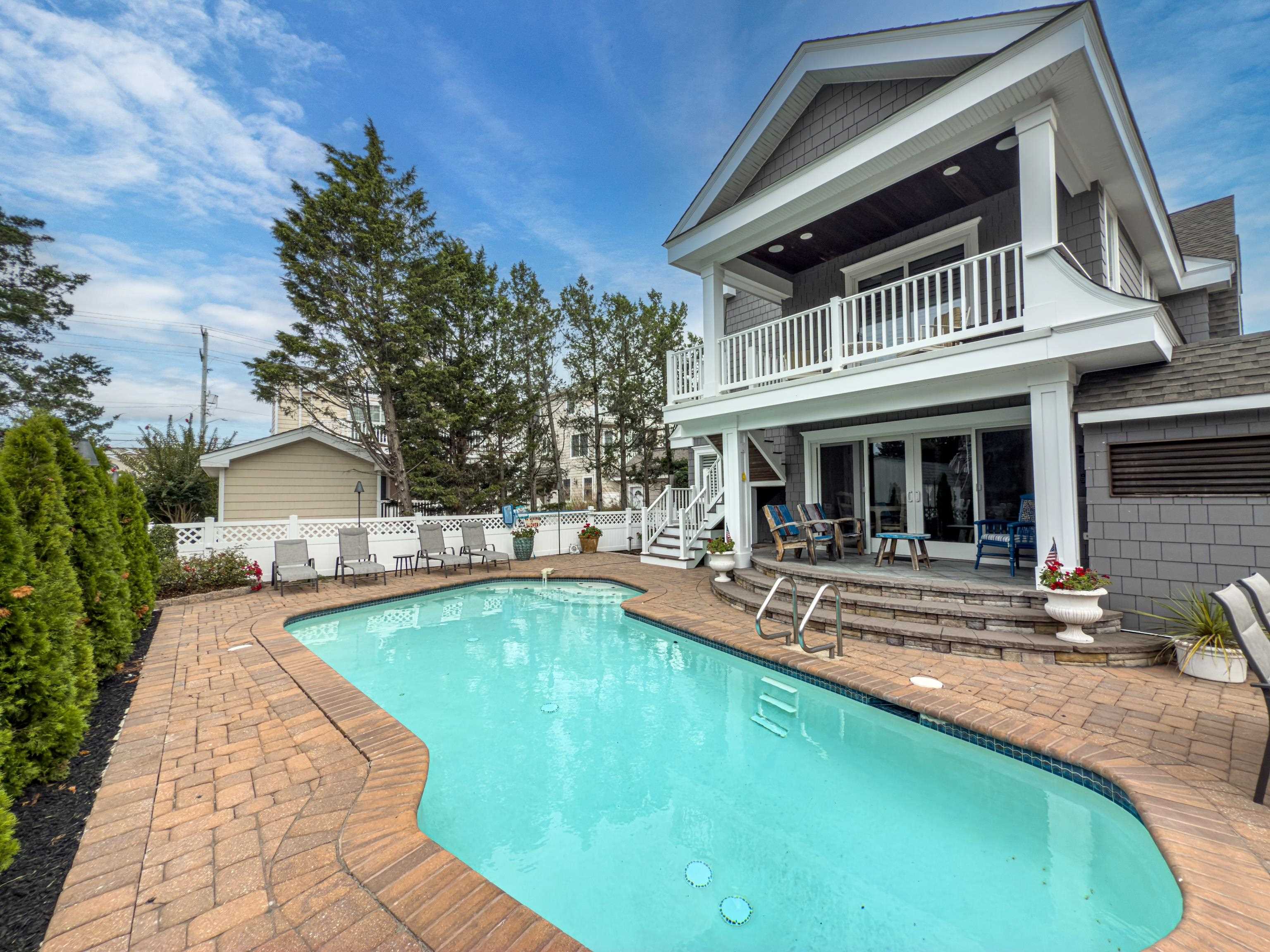 178 37th Street Avalon, NJ 08202 - Photo 24 of 26 a view of a house with swimming pool and sitting area
